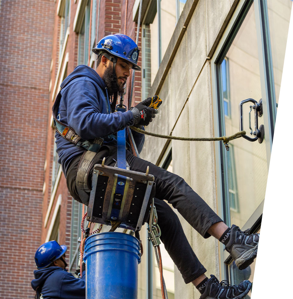 fresh approach man cleaning a high rise window